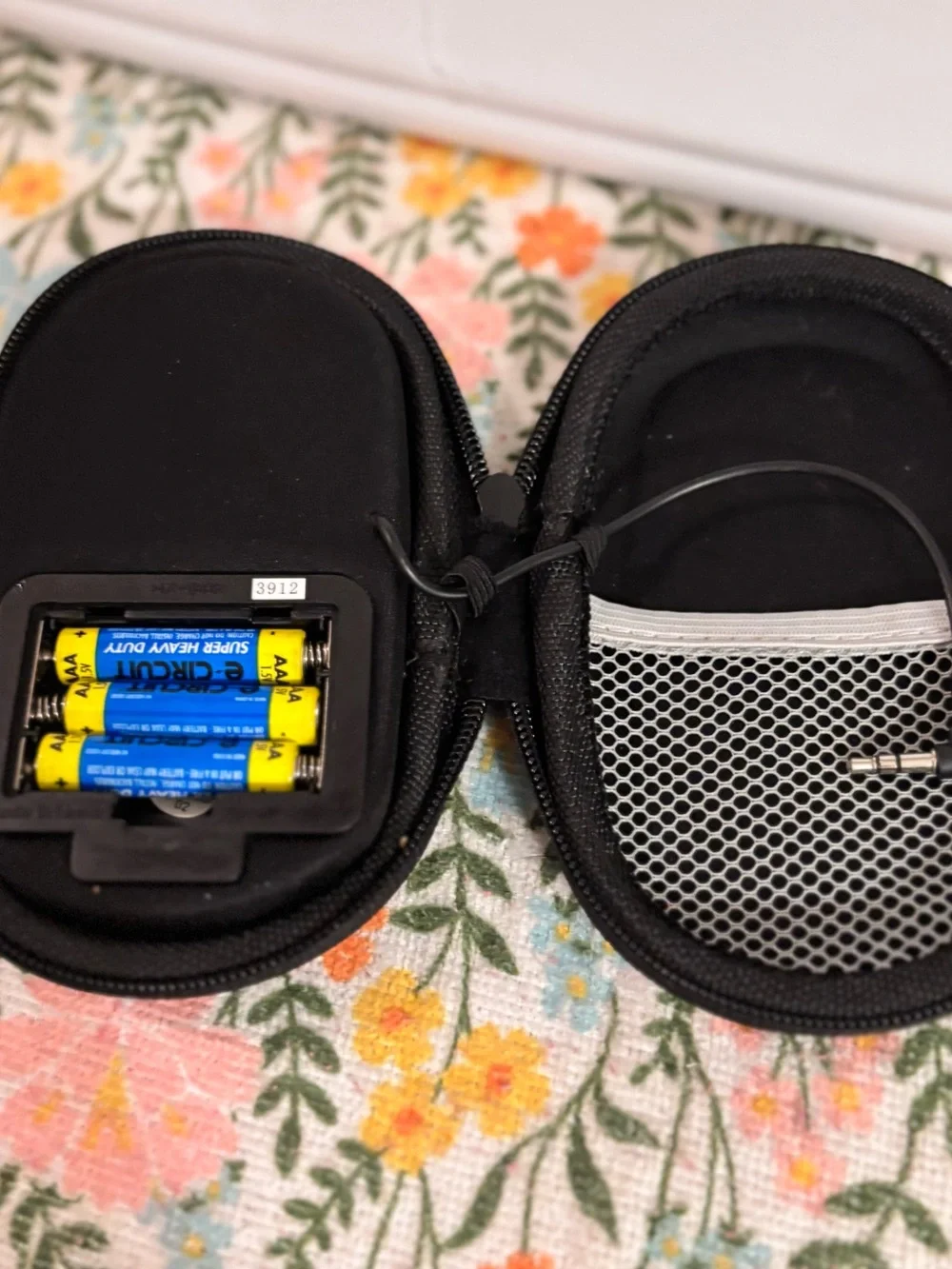 HMDX HX-G03 portable speaker featuring a black fabric grill and silver accents